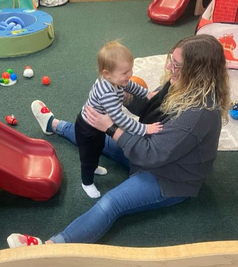 Teacher with child in movement room