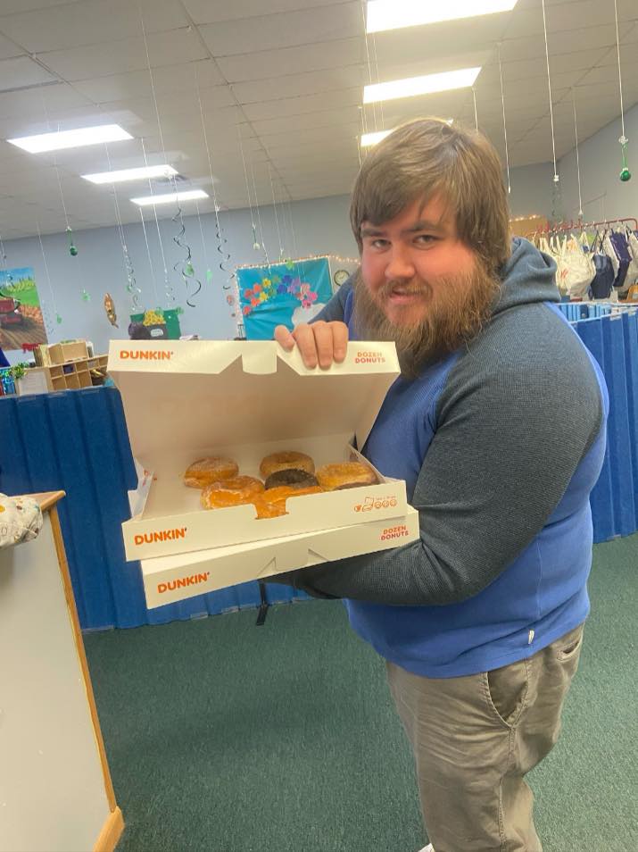 Teacher offering donuts