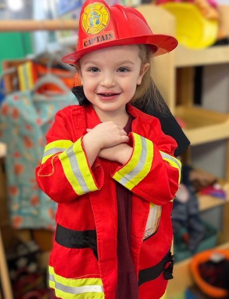 Little girl in firefighter costume